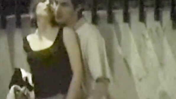 A girl with huge tits is taking care of two guys at the same time